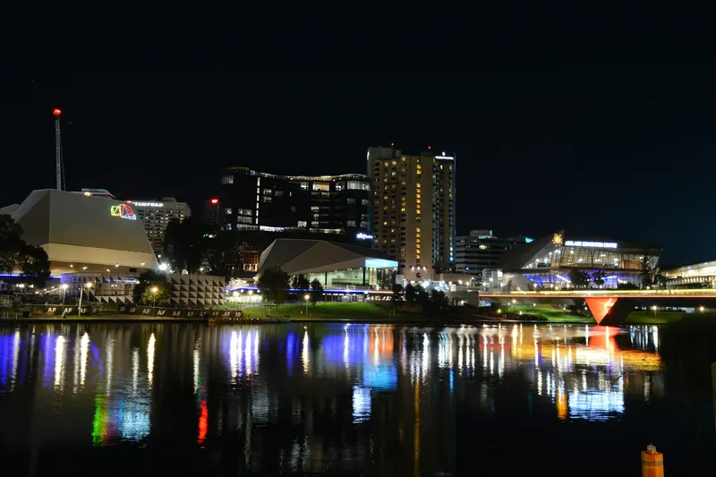 Adelaide’s riverbank at night, city lights reflected in the Torrens